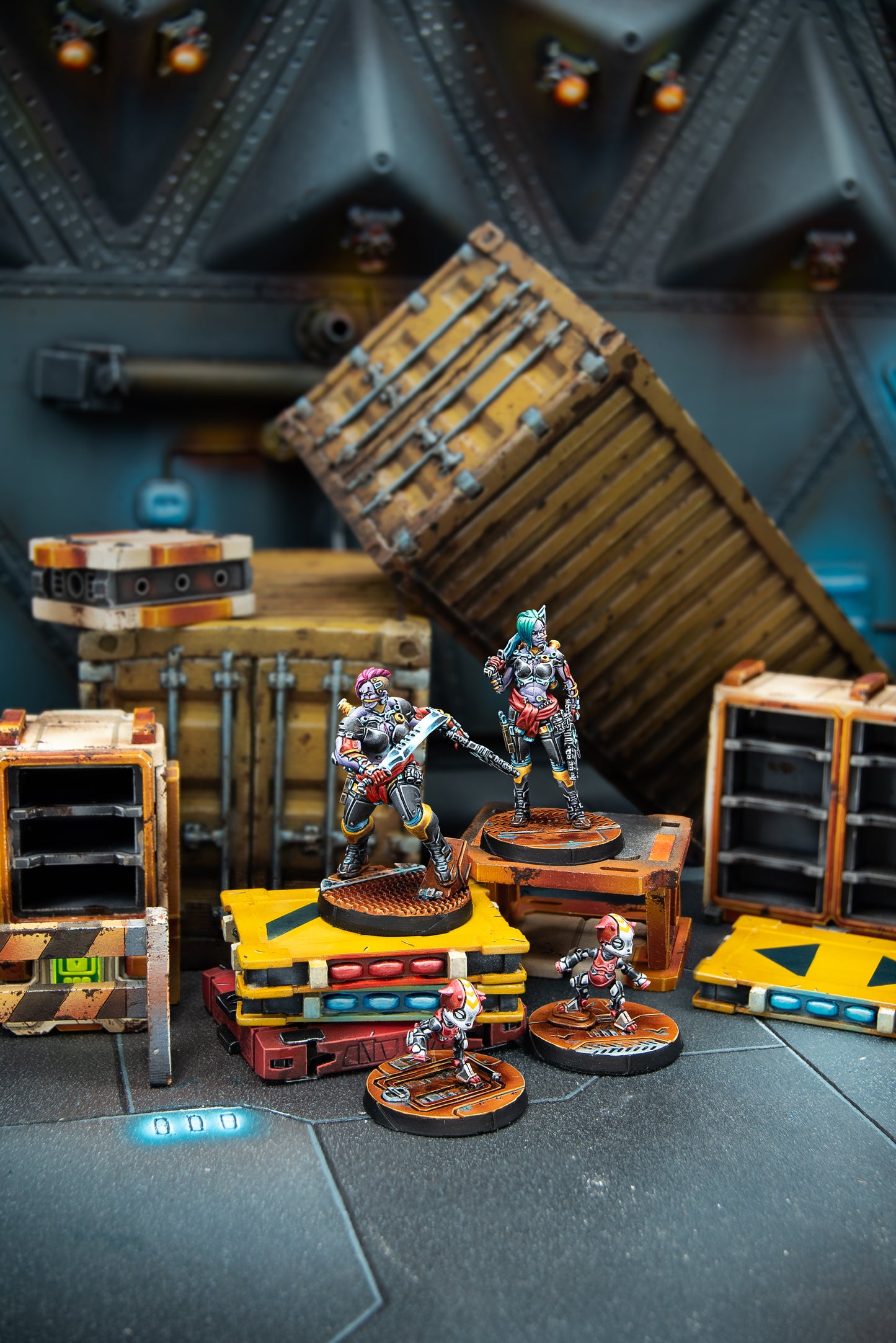 Toy figures on a dark surface with wooden crates and shelves in the background
