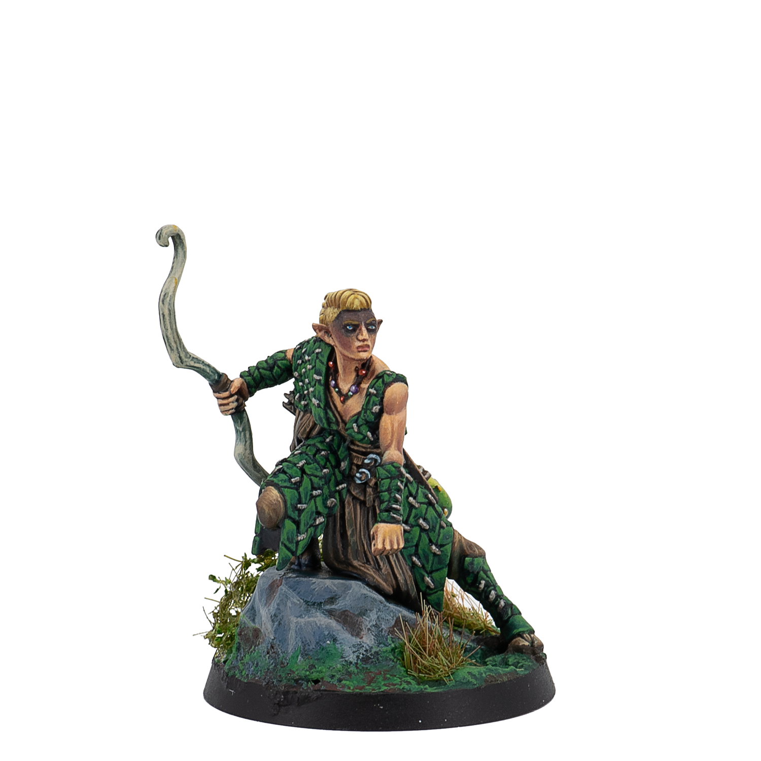 Figurine of a character in green attire with a bow, sitting on a rock with a white background